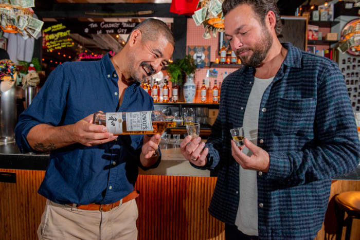 Mixologist Masahiro Urushido and Dewar's brand ambassador Gabe Cardarella sample Dewar's Japanese Smooth Scotch whisky.