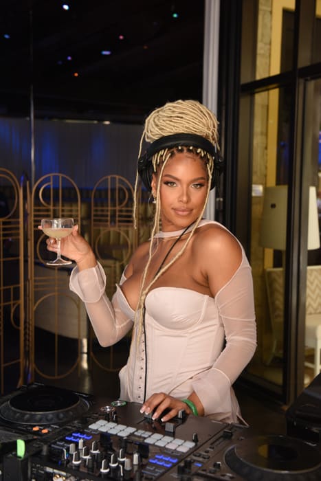 DJ Millie toasts with a Grey Goose Essence cocktail at the Grey Goose Essences x GRAMMYs: Sound Sessions featuring Tinashe at Intrigue, WYNN Las Vegas