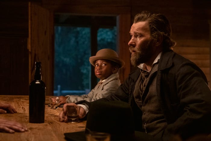 Chase W. Dillon as Homer and Joel Edgerton as Ridgeway in The Underground Railroad