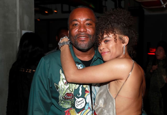 Lee Daniels and Andra Day embrace at an Oscars after-party thrown in her honor.