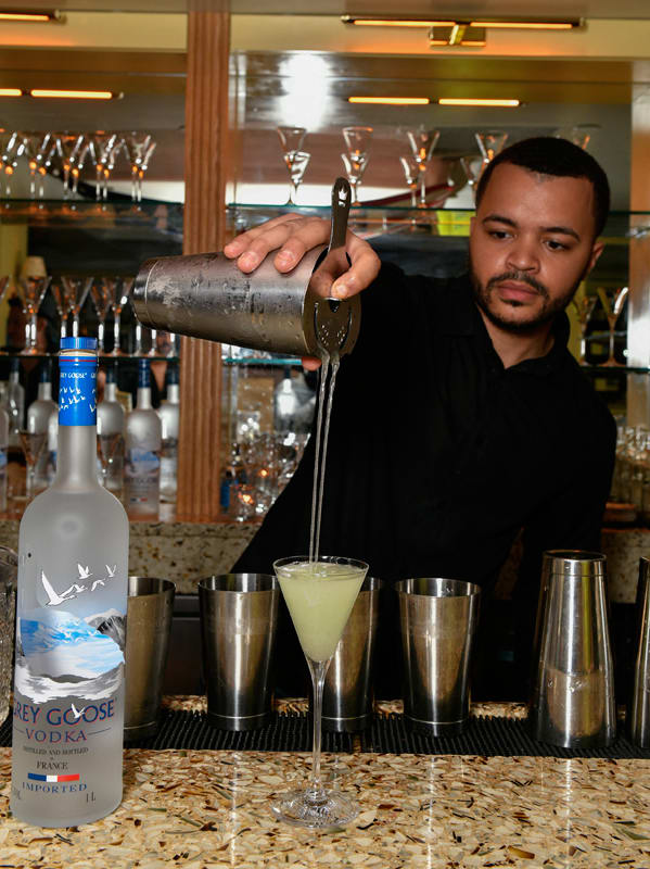 A bartender pours one of the signature Grey Goose serves at the Prabal Gurung after-show party on September 8, 2021.