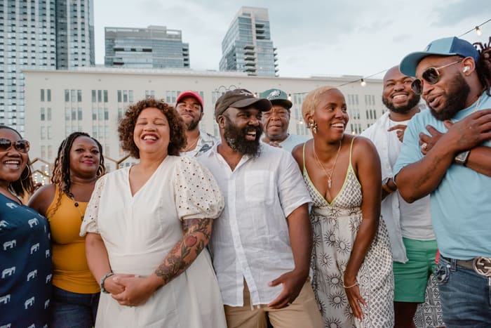 Cybille St.Aude-Tate (center-left) and Chef Omar Tate enjoy a laugh with the farmers who supplied ingredients for the inaugural "Cultivating Community" dinner and Chef Brittney "Stikxz" Williams (center-right) who prepared the delectable dishes.