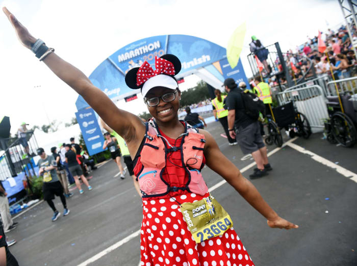 A runner completes the runDisney marathon in 2020.