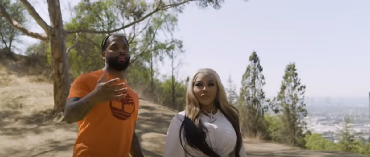 Screenshot of the Hiking with Rappers trailer, featuring host Keraun Harris and Lil Kim.