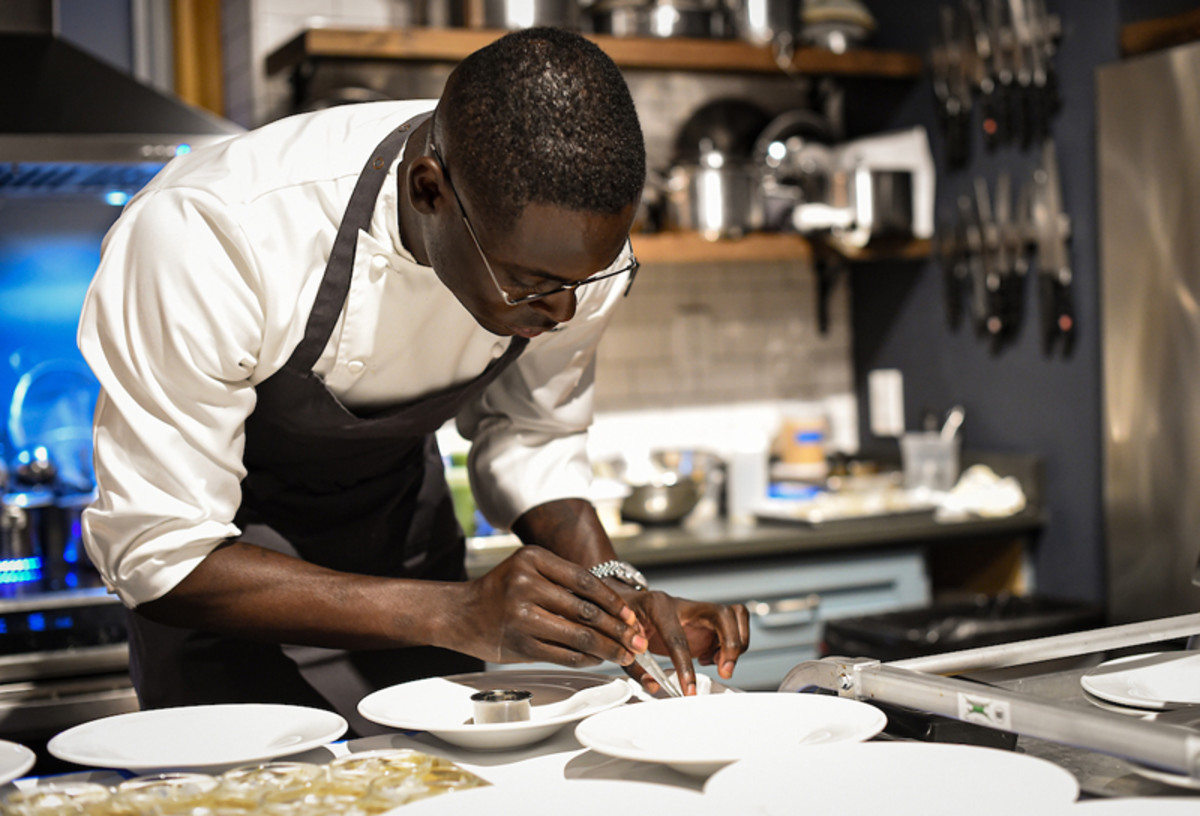 Chef Rōze Traore plates cuisine at Courvoisier's "Welcome to Our Kitchen" dinner