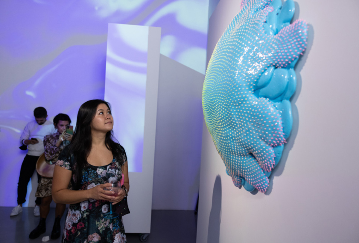 Artist Dan Lam admires her Bombay & Tonic-inspired sculpture during a preview of Bombay Sapphire's Sensory Auction.