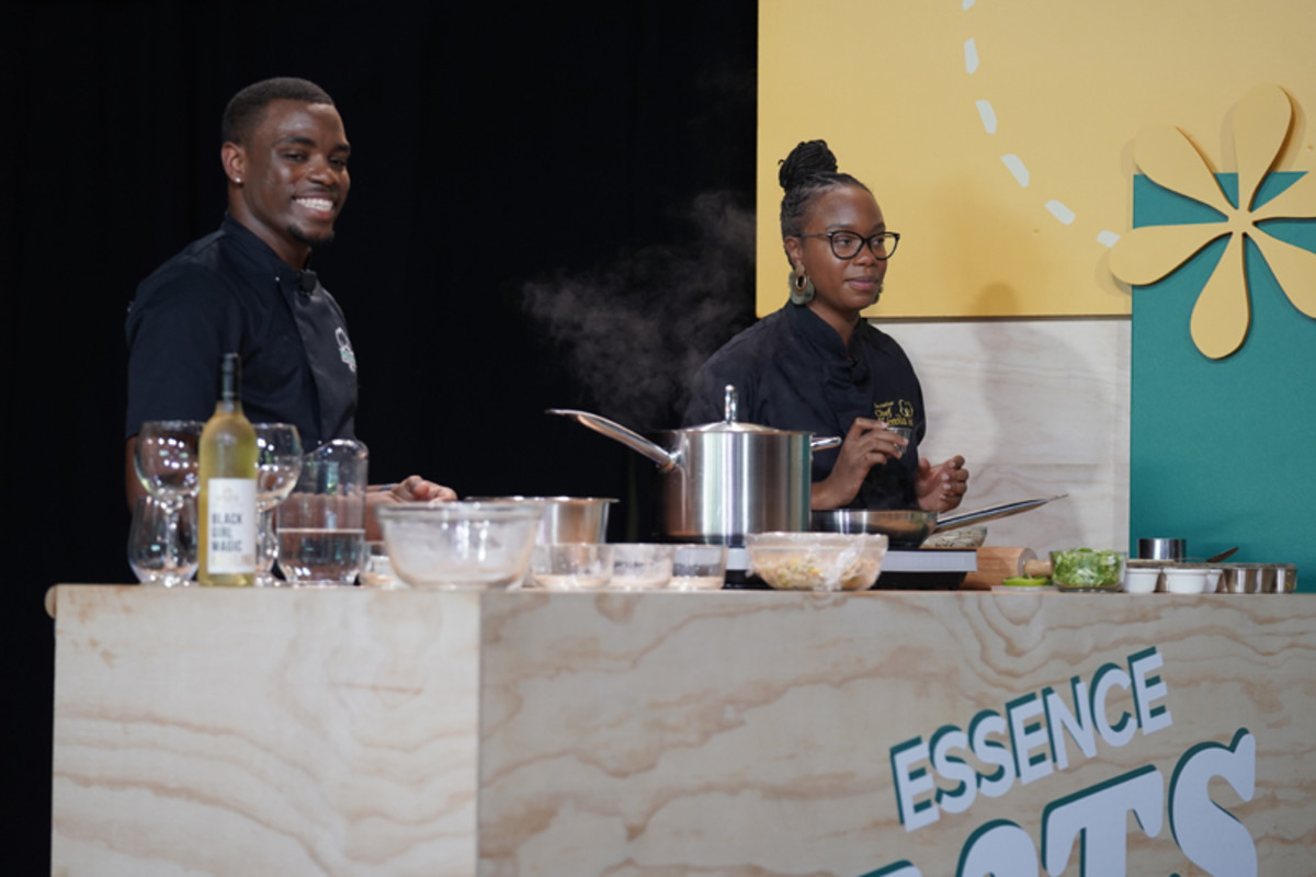 Chefs Brooks and Hyman prepared Journey Cakes and Saltfish and Stuffed Dumplings with Crab, respectively, during a demonstration of cuisine from Saint-Martin at the 2022 ESSENCE Festival of Culture.